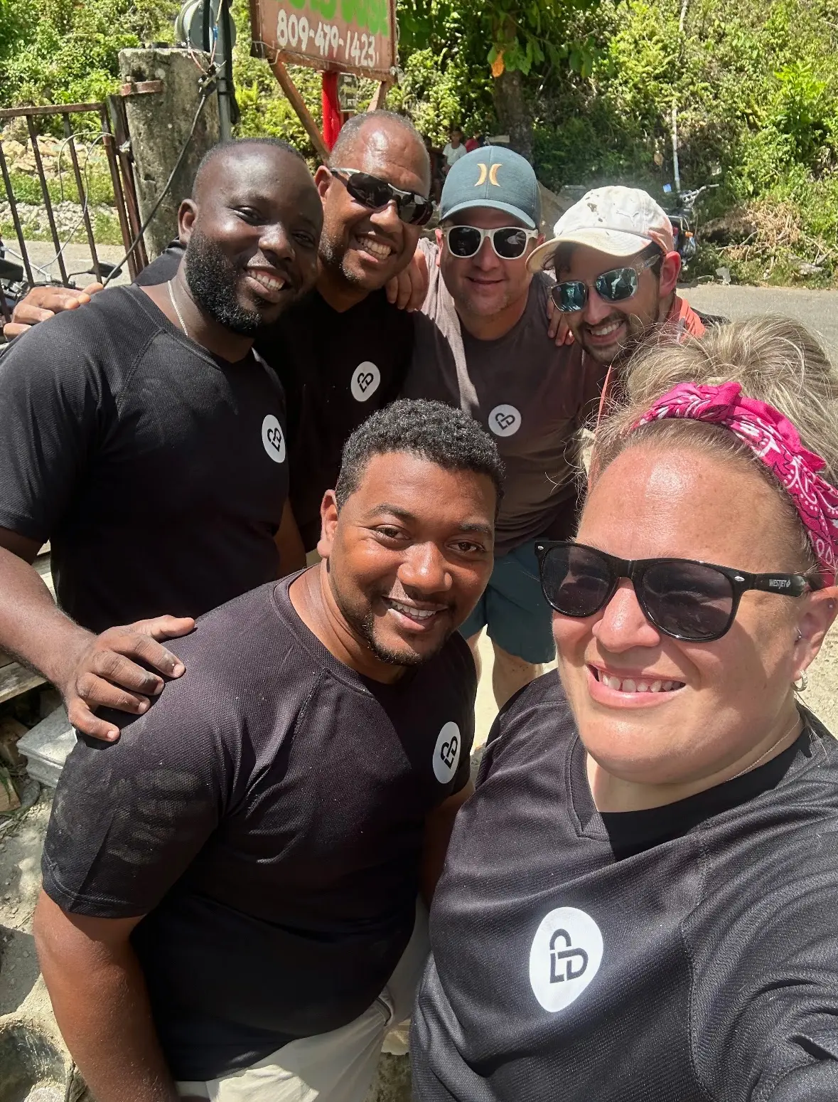 LiveDifferent team members smiling together on a build trip